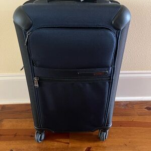 Tumi Navy Rolling Suitcase